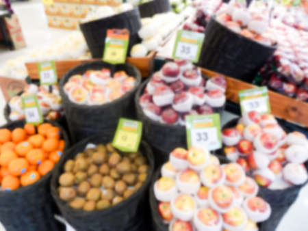 Fresh fruits in supermarket blurred backgroundの写真素材