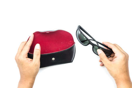 Man holding fashion sunglasses isolated on white background