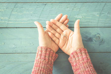 Engagement ring in female handsの写真素材