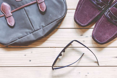 Outfit of traveler on wooden backgroundの写真素材