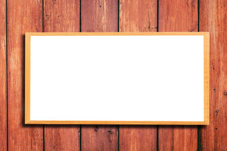 Mock up blank wooden picture frame on wooden wallの写真素材