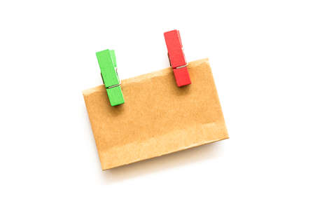 Colorful wooden pins and paper isolated on  white backgroundの写真素材