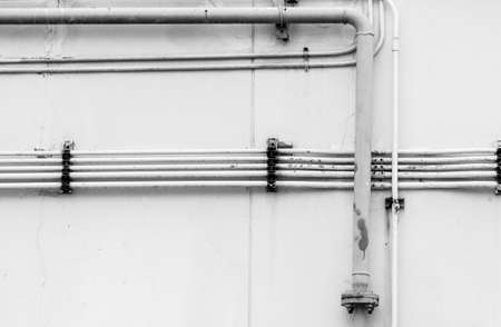 Pipeline water detail at industrial building wallの写真素材