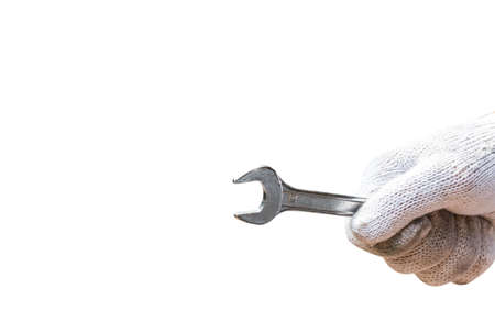 Metal wrench in male hand  isolated on the white background. This has clipping pathの写真素材