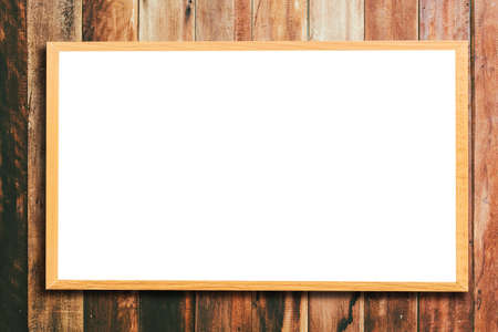 Mock up blank wooden picture frame on wooden wallの写真素材