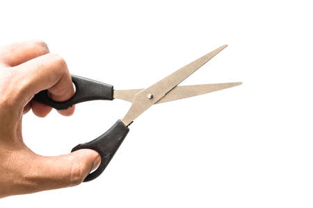 Hand with professional Haircutting Scissors isolated on white Backgroundの写真素材
