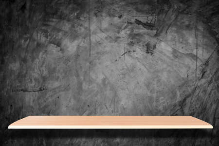 Wooden shelves and stone wall background for product displayの写真素材