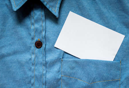 Blank white card with copy space in a pocket of shirt