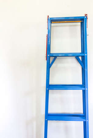 Ladder on white wall backgroundの写真素材