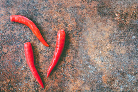 Red hot chili pepper  on stone backgroundの写真素材