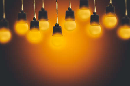 Light bulbs on a warm gradient backgroundの写真素材
