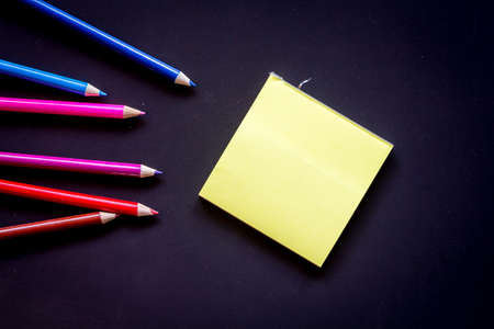 Paper with crayon on black backgroundsの写真素材
