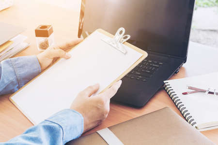 Businessman using  laptop at office desk