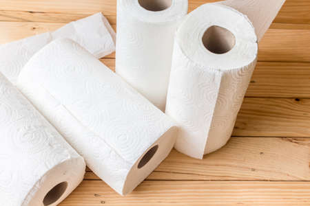 Roll of paper towel on wooden backgroundの写真素材