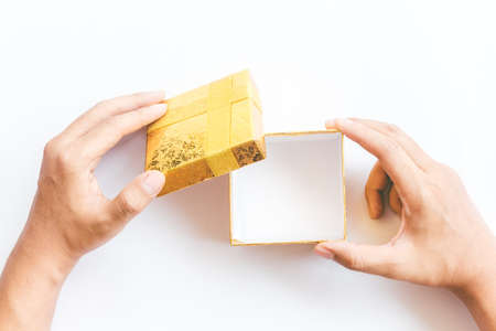 Hands hold and open the empty(blank) box on white backgroundの写真素材