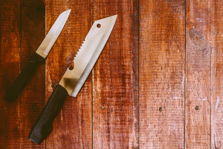 Knife on rustic kitchen table with copy spaceの写真素材