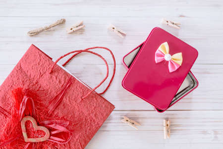 Red gift box with red bag on wooden backgroundの写真素材