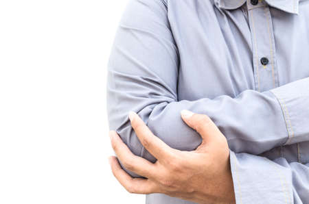Man is touching his elbow due to acute pain isolated on the white backgroundの写真素材