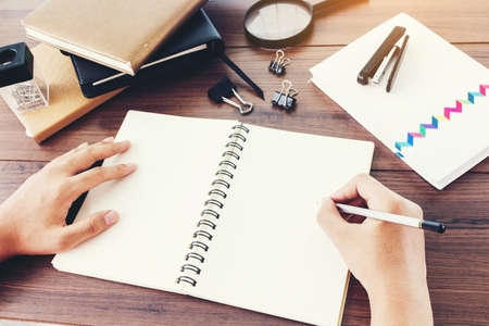 Man hand writing on notebookの写真素材