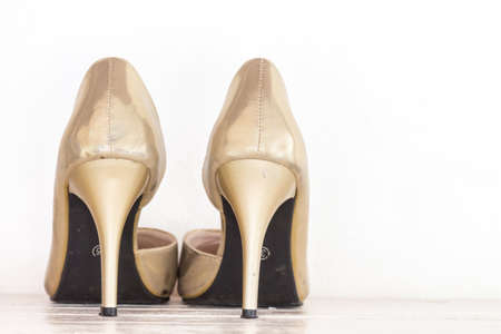 Female shoes on wooden tableの写真素材