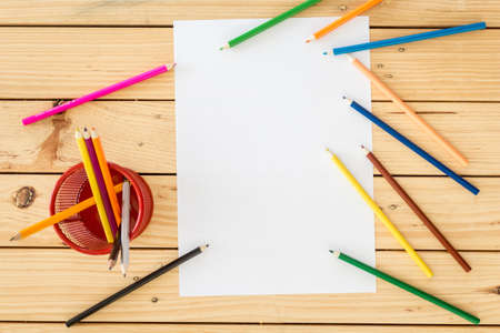 Drawing and paper on wooden table background