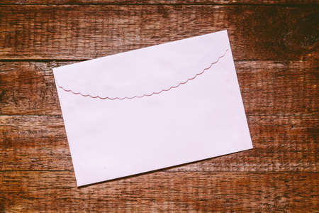 A envelope on wooden background
