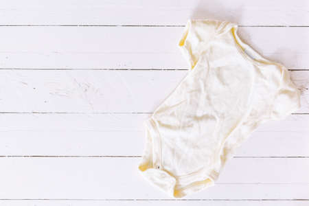 Clothes for baby on wooden backgroundの写真素材