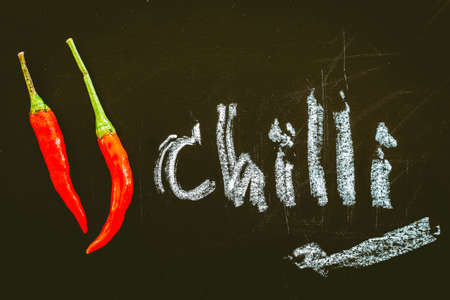 Red hot chili pepper on black backgroundの写真素材