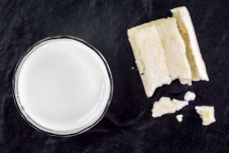 Milk on black tableの写真素材