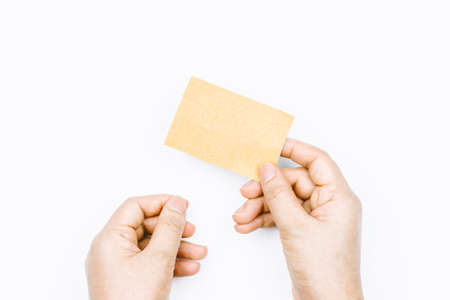 Hand holding paper on white backgroundの写真素材