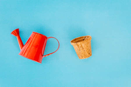 Watering can on blue backgroundの写真素材