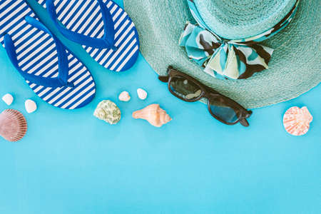 Beach accessories on blue backgroundの写真素材