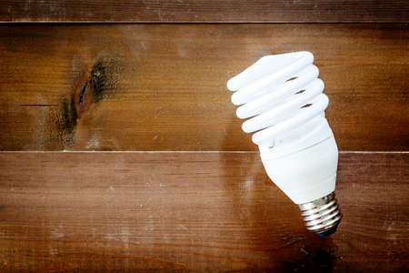 Light bulb on wooden table