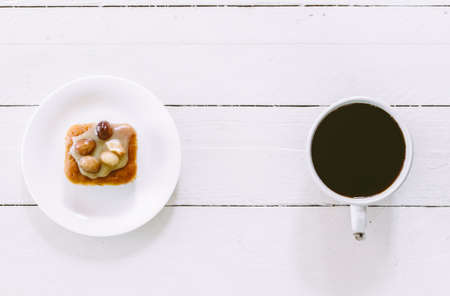 Coffee and cake on the wooden tableの写真素材