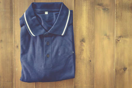 Blue shirt on the wooden tableの写真素材