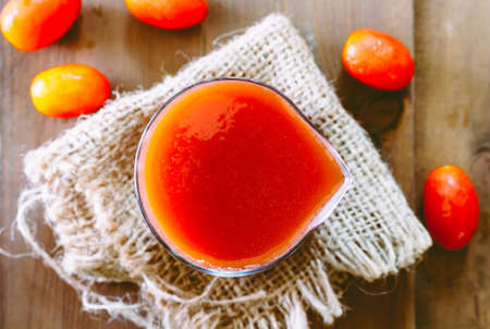 Tomato Juice on wooden table