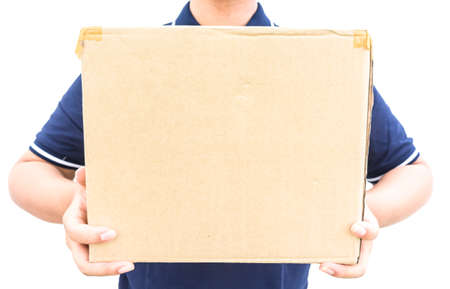 Delivery man in blue uniform holding the box isolated on white backgroundの写真素材
