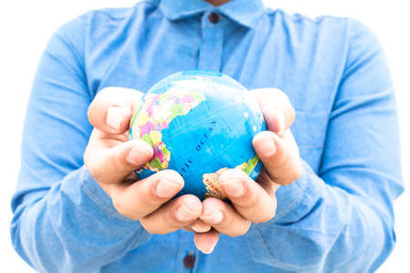 Business man holding globe model isolated on  white backgroundの写真素材