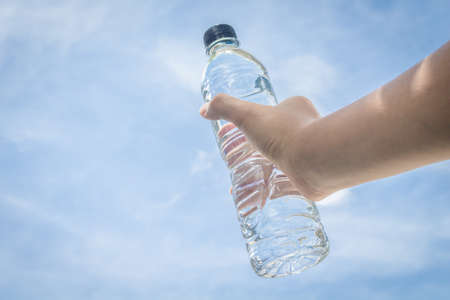 Hand holding water bottleの写真素材