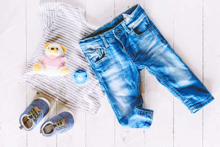 Children clothing on wooden backgroundの写真素材