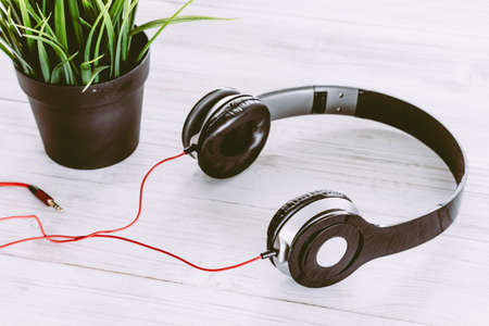 Headphones on wooden backgroundの写真素材