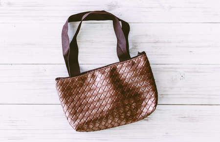 Women's handbag on wooden backgroundの写真素材