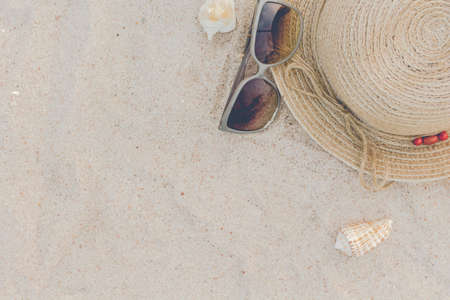 Straw hat with sun glasses  on a tropical beachの写真素材