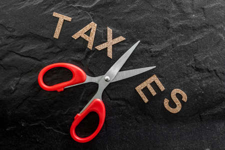 Scissors and the alphabet TAXESの写真素材