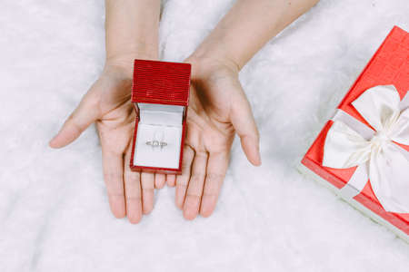 Woman hands holding elegant diamond ringの写真素材