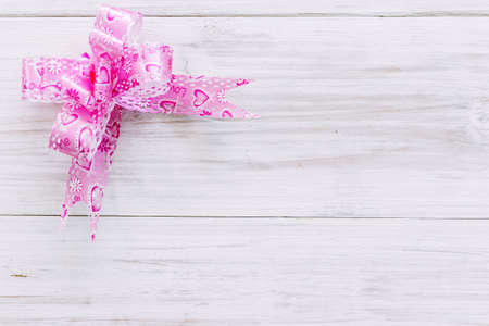 Ribbon on wooden  backgroundの写真素材