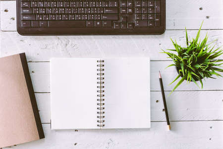 Office table with notepad and computer