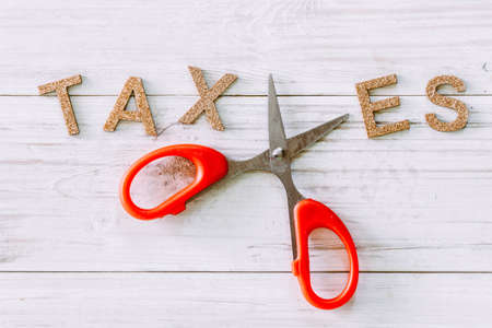 Scissors and the alphabet TAXES