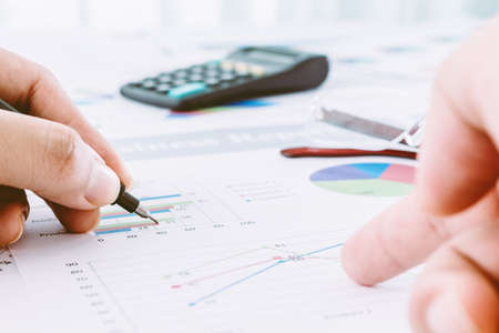 Businessman hands working and holding business graph information