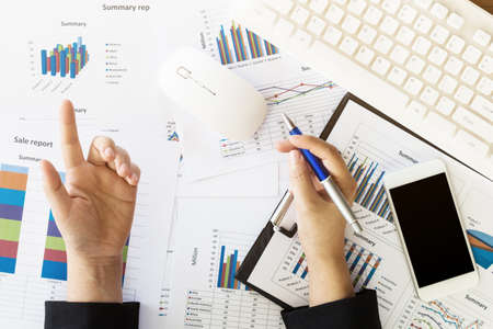 Business woman working at office with documentsの写真素材